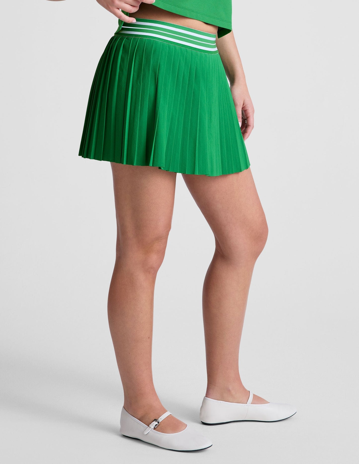 Performance Pleated Mini Skirt: Built-in Shorts, Pockets, Striped Waistband