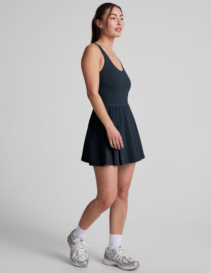 Active Pleated Mini Dress: Built-in Shorts, Pockets, Open Back Design